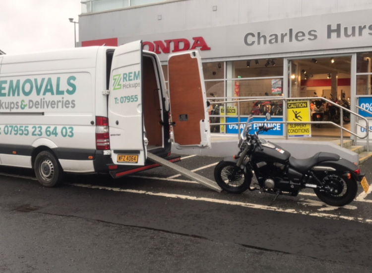 Van and motorbike prepared for delivery