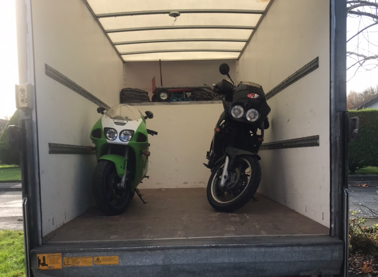 Two motorbikes loaded in the truck